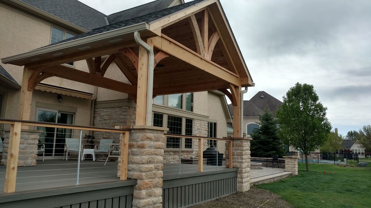 covered porch with stone and wood work
